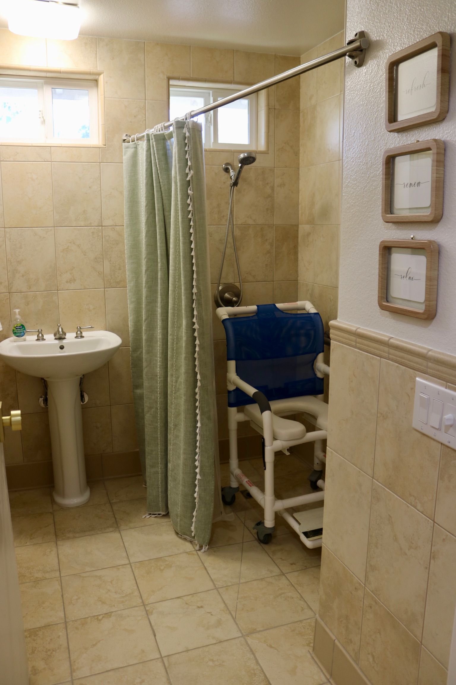 Accessible roll-in shower room with grab bars and safety features