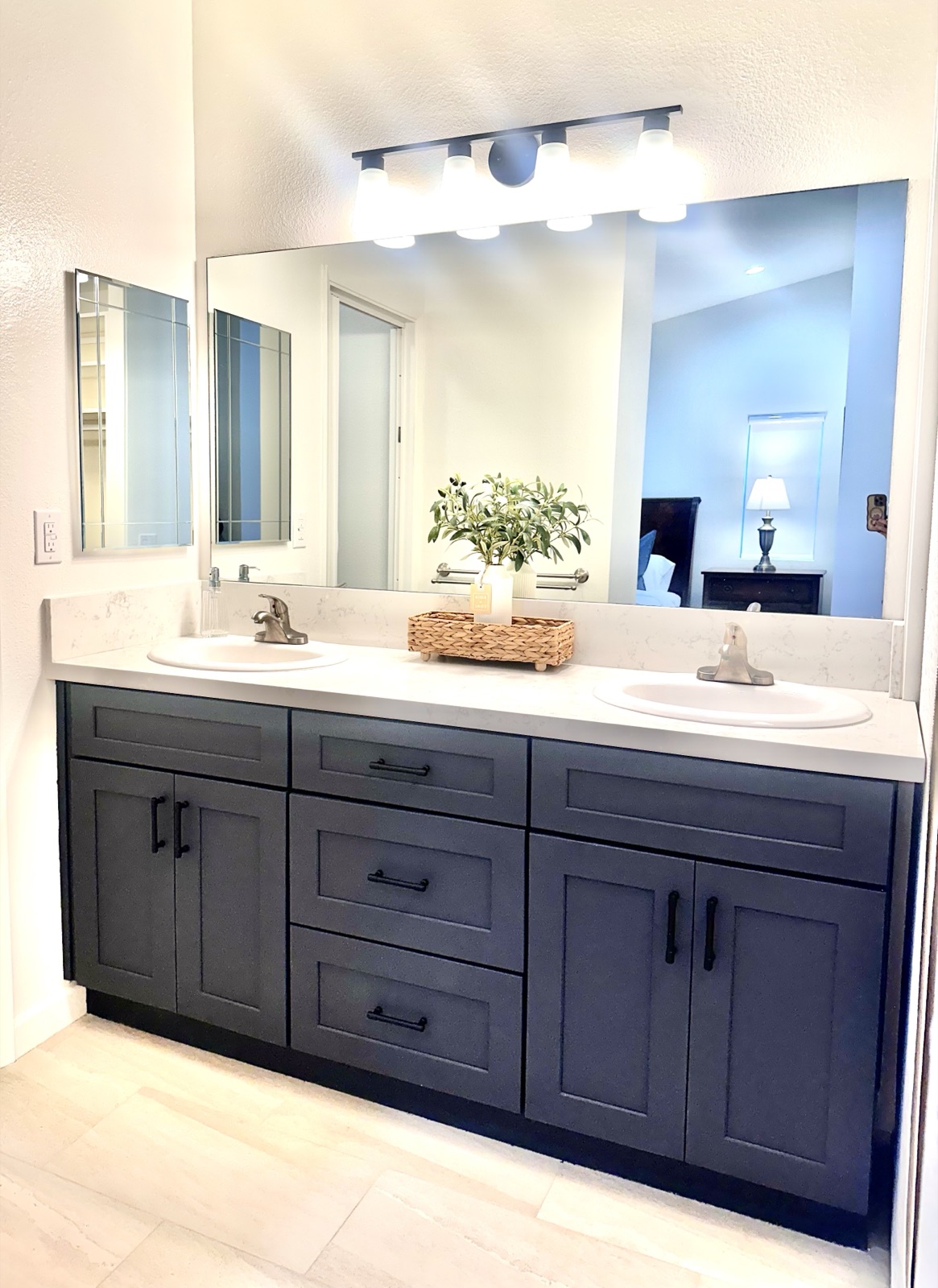 Private double-vanity bathroom with a large lit mirror