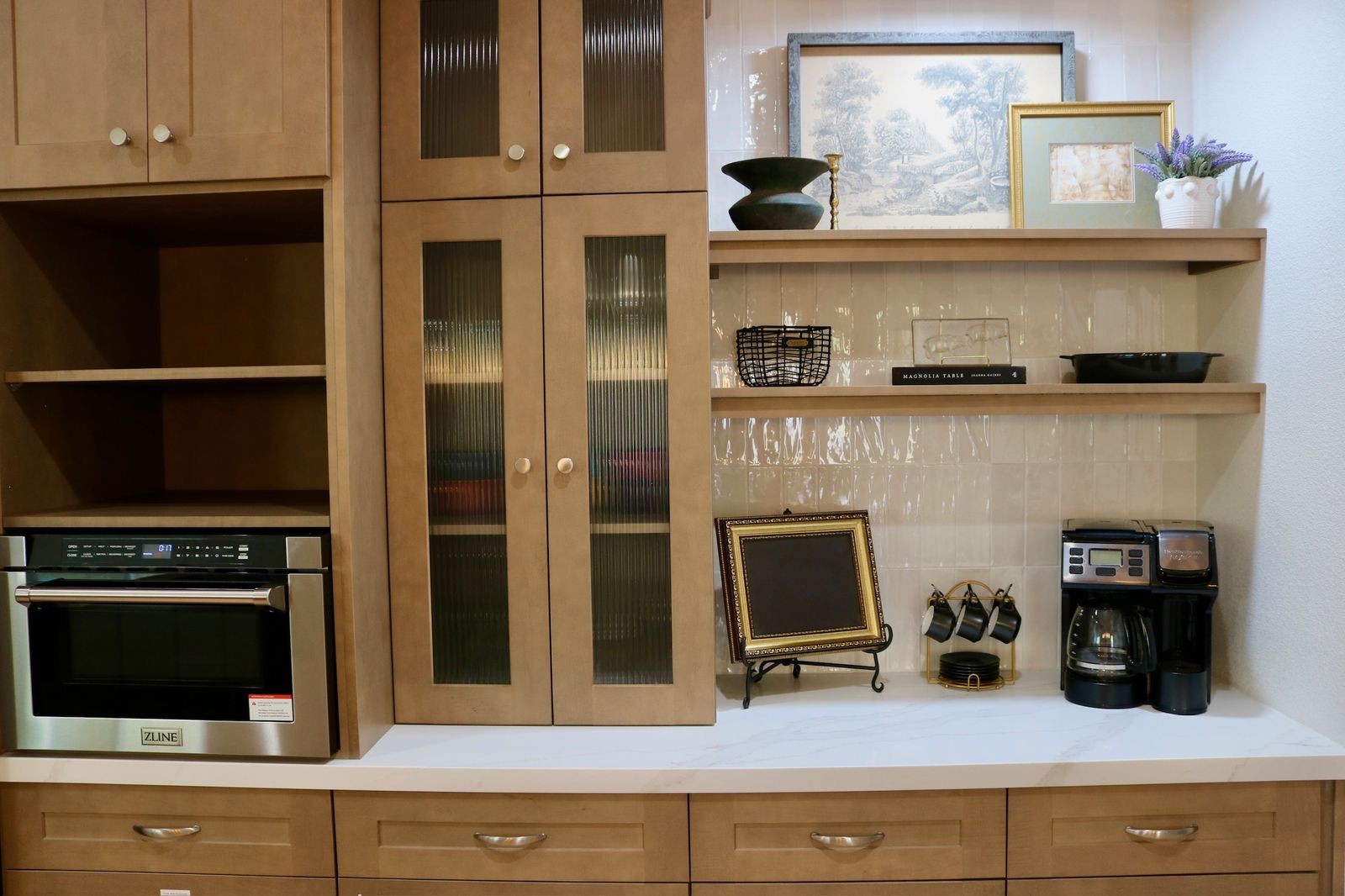 Coffee bar area with cabinetry and comfortable seating